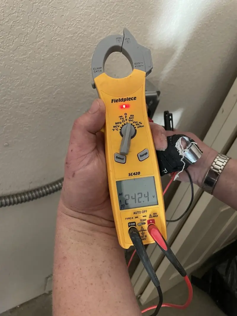 Voltage testing with clamp meter during Generator Installation in Oak Grove